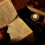 videoblocks-reading-old-book-under-candlelight-monk-reads-the-old-liturgical-book-in-the-monastery-cell-under-candlelight_hlmfxigvil_thumbnail-full01